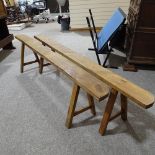 A pair of 19th century French fruitwood trestle type benches, length 2m