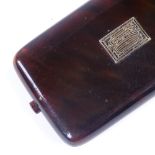 An early 20th century tortoiseshell card case, with gold inlaid lid, 8cm x 5cm Very good condition