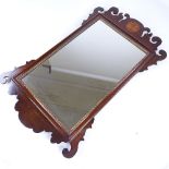 A Georgian mahogany-framed wall mirror, overall height 65cm The bottom right-hand scroll has been