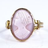 An unmarked gold relief carved pink coral cameo panel ring, setting height 16mm, size Q, 2.8g Very