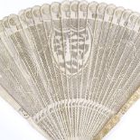 A 19th century Chinese ivory brise fan, with relief carved end panels and carved and pierced sticks,