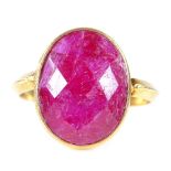 A modern unmarked silver-gilt faceted ruby dress ring, setting height 17.4mm, size M/N, 3.7g Good