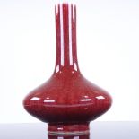 A Chinese sang de boeuf glaze porcelain narrow-necked vase, 6 character mark, height 18cm Small chip