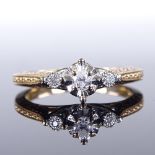 A modern 9ct gold 3-stone diamond dress ring, engraved shoulders with heart-shaped bridge, total