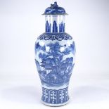 A Chinese blue and white porcelain vase and cover, hand painted landscape decoration, overall height