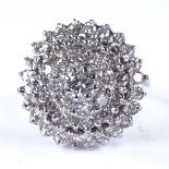 A mid-20th century 18ct white gold diamond cluster cocktail ring, total diamond content approx 1.