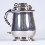 A large electroplate lidded tankard, engraved under base The Benjamin Franklin Tankard, height