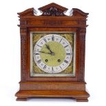 A 19th century walnut-cased 8-day architectural mantel clock, carved case with column-front