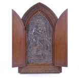 A relief cast patinated spelter icon in original carved wood lancet-topped cabinet, height 27cm