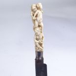 A George III knife with carved ivory cherub design handle, length 18cm There is a natural line