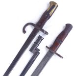 A First War Period sword bayonet with leather scabbard, and 2 other early 20th century bayonets (3)