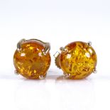 A pair of 9ct gold cabochon amber earrings, amber diameter 9mm, 2.6g Very good original condition,