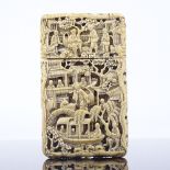 A 19th century Chinese relief carved ivory card case, heavily carved all over with river and
