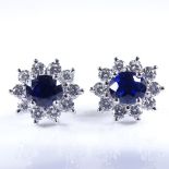 A modern pair of unmarked white metal sapphire and diamond cluster earrings, platinum butterflies,