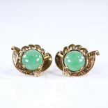 A pair of Chinese unmarked gold jade earrings, engraved foliate decoration with screw fittings,