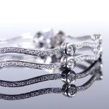 A modern platinum diamond set articulated double-row bracelet, total diamond content approx 2ct,