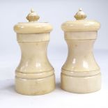 A pair of 19th century ivory pepper grinders, height 10cm Good condition, working order