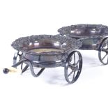 A 19th century Sheffield plate wheeled decanter coaster trolley, with relief cast grapevine surround