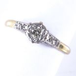 An 18ct gold 0.1ct solitaire diamond ring, with diamond set shoulders, setting height 5.6mm, size M,