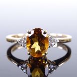 A modern 9ct gold citrine and diamond dress ring, size P, 2.3g Very good original condition, all