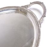 A large Elizabeth II oval silver 2-handled tea tray, gadrooned rim with scrolled acanthus leaf