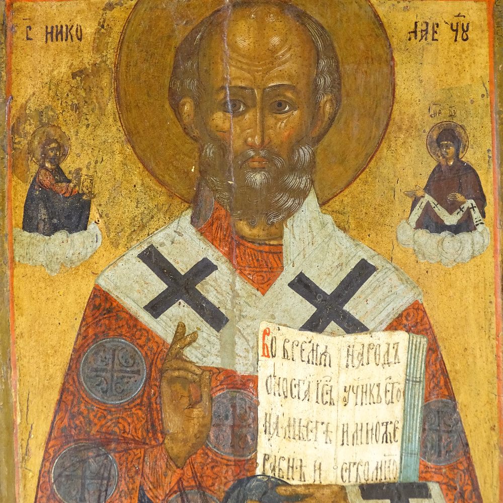 A 19th century Russian painted and gilded icon on wood panel, 27cm x 22cm Several minor paint