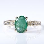 A 14ct gold solitaire emerald ring, with diamond set shoulders, oval-cut emerald approx 0.71ct,