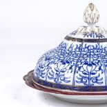 A Worcester blue white and gilt decorated muffin dish and cover, diameter 19cm Base has a restored
