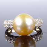 A 14ct gold cultured South Sea pearl dress ring, with diamond cluster shoulders, total diamond