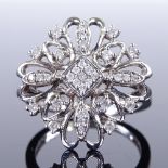 A modern 9ct white gold diamond cluster cocktail ring, setting height 20.1mm, size N, 4.8g Very good