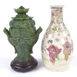 A Chinese carved green stone vase and cover, on hardwood stand, height 24cm, and a Chinese bottle