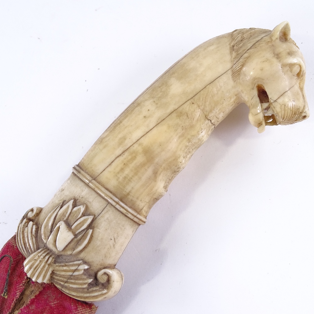 A Middle Eastern dagger, 18th or 19th century, the carved ivory handle having a leopard's head - Image 2 of 3