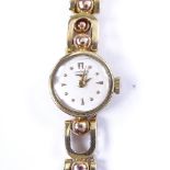 LONGINES - a lady's 14ct gold Eszeha mechanical wristwatch, silvered dial with gilt arrow and dot