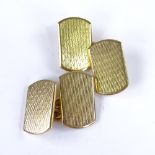 A pair of early 20th century 18ct gold curved rectangular panel cufflinks, engine turned decoration,