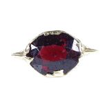 A 19th century 14ct gold garnet dress ring, engraved bridge and shoulders, 8.9mm, size M, 2g Fair