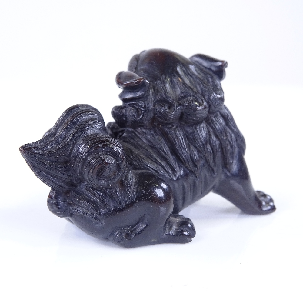 A Japanese carved and stained wood Dog of Fo design netsuke, signed, length 6cm - Image 2 of 3