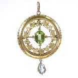 An early 20th century unmarked yellow metal stone set floral pendant, pendant height excluding