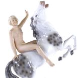 A German porcelain naked figure riding a horse, height 28cm One finger tip broken, otherwise perfect