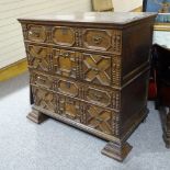 A late 17th/early 18th century oak chest of 4 long drawers, with applied moulded and split turned