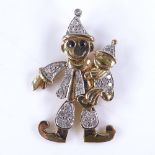 A modern novelty 9ct gold gem set articulated figural clown pendant, set with sapphires and