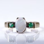 A late 20th century unmarked gold 3-stone cabochon opal and emerald dress ring, setting height 7.