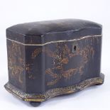 A Victorian papier mache tea caddy, painted and gilded floral decoration, with serpentine front