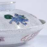 A Chinese white glaze porcelain bowl and cover, painted enamel dragons and sea creatures, 6