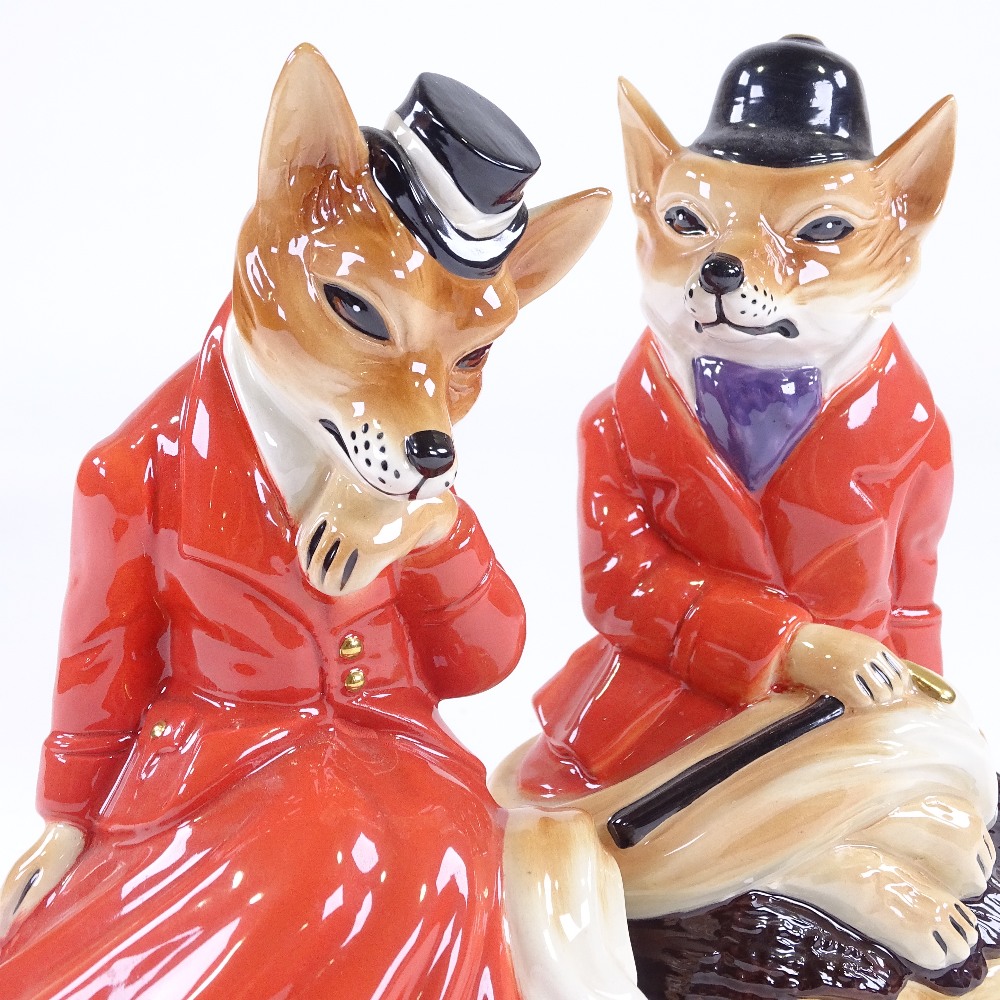 A pair of Cooper Craft Staffordshire China hunting foxes in red coats, height 19cm Perfect condition