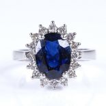 A modern 18ct white gold sapphire and diamond cluster ring, total diamond content approx 0.35ct,