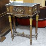 A 19th century French parcel gilt and walnut jardiniere, with zinc liner, and relief moulded