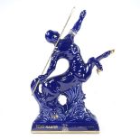 A bottle of Remy Martin Fine Champagne Cognac, presented in a Limoges blue centaur design