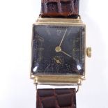 An Art Deco 9ct gold cushion-cased mechanical wristwatch, black dial with Arabic numerals and