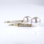 A pair of unmarked gold cultured pearl and diamond drop earrings, earring height excluding fitting