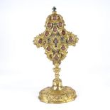 An 18th century reliquary, gilded bronze with small inset oval glass-fronted panels containing